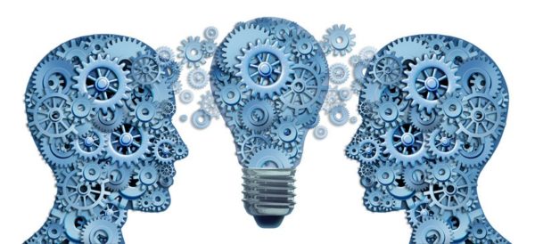 cogs and gears make up two human heads and a lightbulb